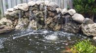 A concrete pad was installed and now the waterfall is properly supported